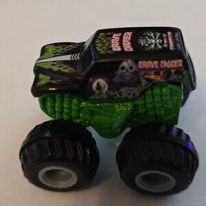 Grave Digger Mini Check photos for condition look nice. Combine for savings